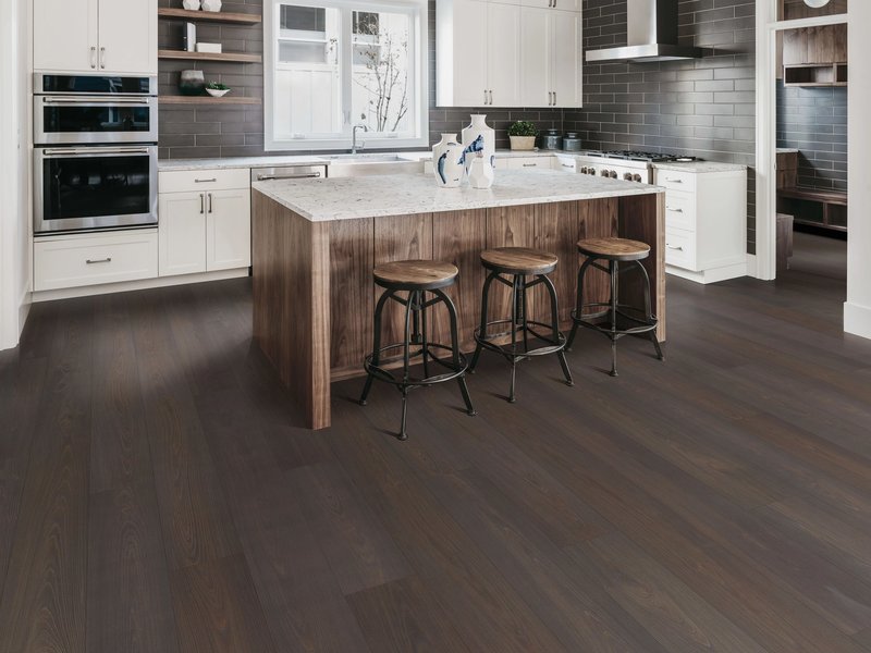 brown hardwood floor and white kitchen furniture in Dickson, TN area by Preston Thompson's Carpet Shoppe